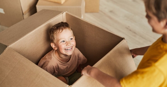 child in a moving box