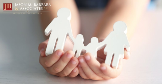 child holding a family figurine
